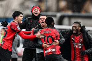 AC Milan players celebrating a goal.